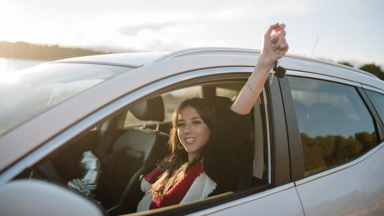 Young woman buying a new car.