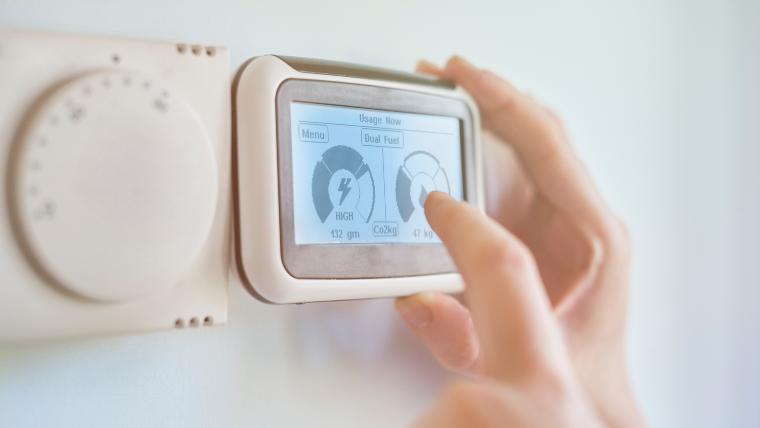 A digital thermostat on the wall