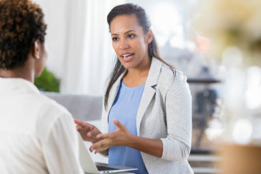 Nonprofit debt counselor speaking with a client