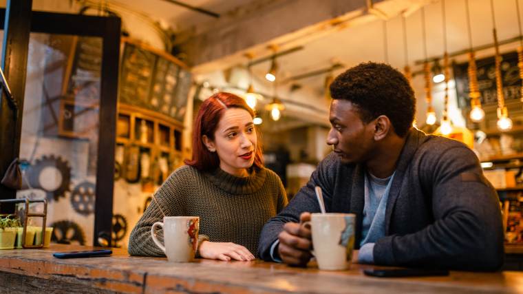 Young couple having a conversation in a coffee shop.