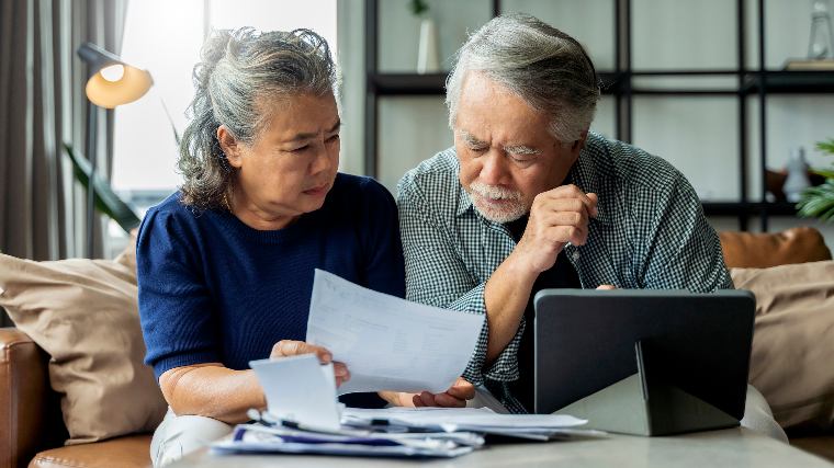 Retired couple reviewing their finances.
