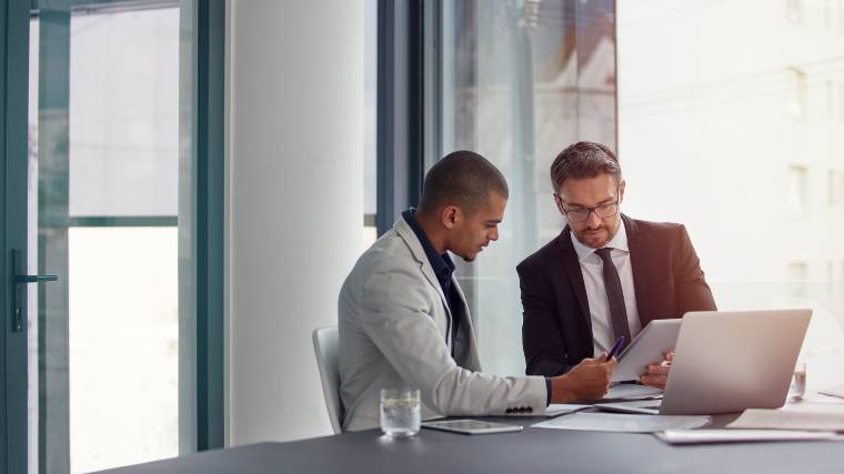 Young professional having a meeting with his boss.