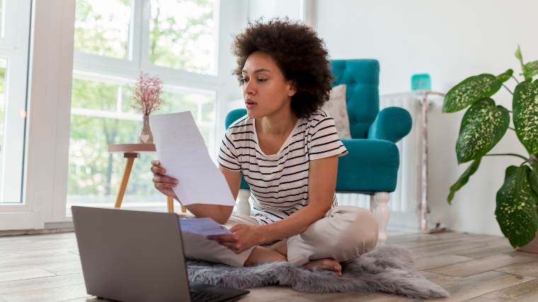 Woman evaluating credit card offer.