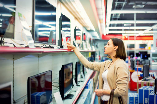 Woman shopping for a new TV