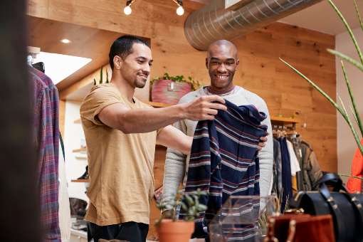 Two men shopping for clothes after the holidays