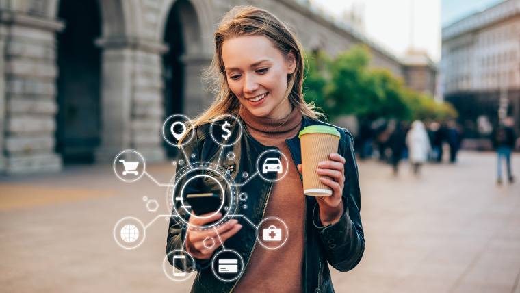 Woman using an investment app on her phone.