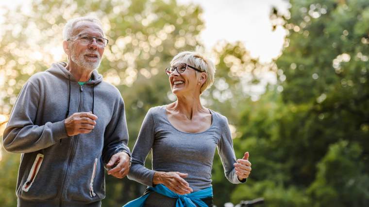 Senior couple going for a jog together.