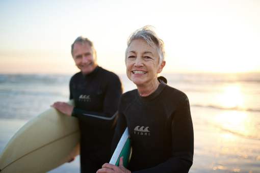 Senior couple surfing