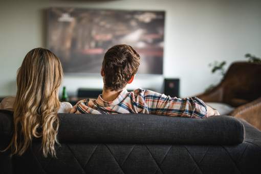 Couple on the couch watching streaming video