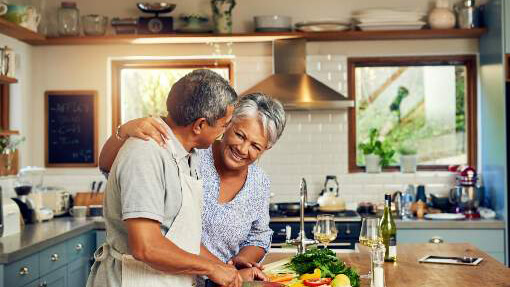 Senior couple making dinner together