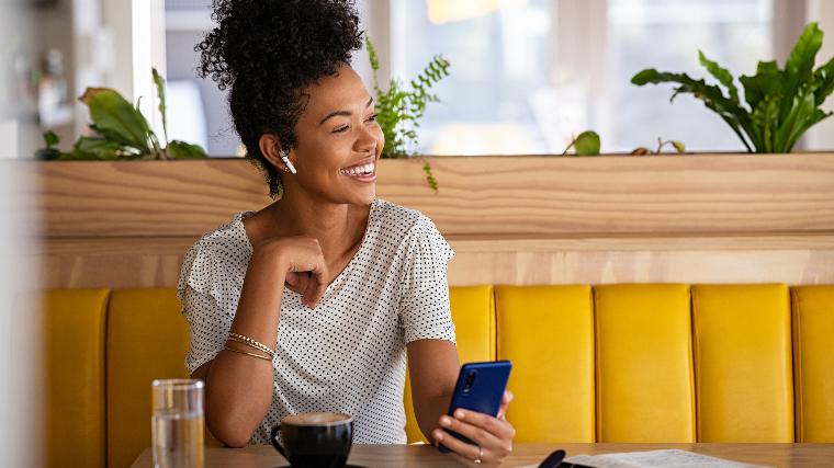 Happy woman in cafe.