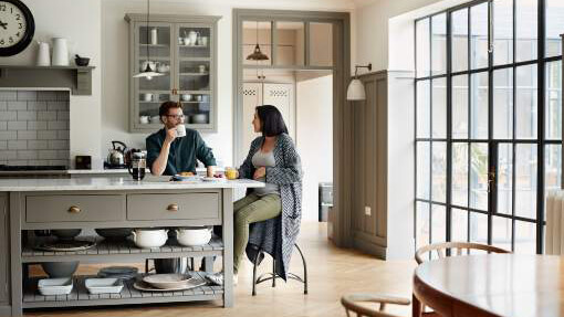 Young couple having a discussion in the kitchen