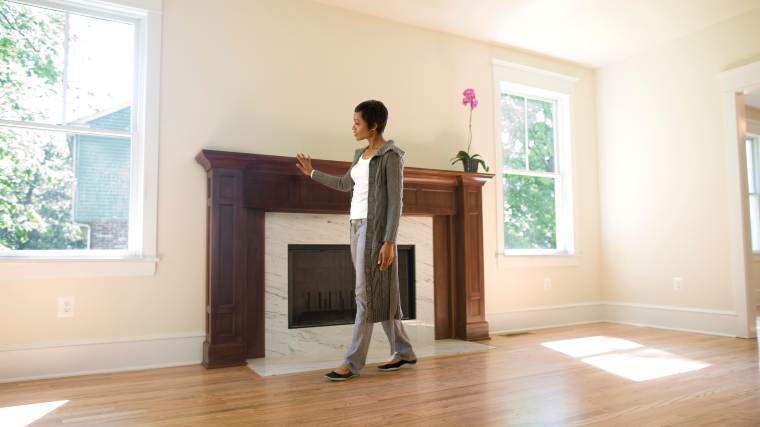 woman admiring a house for sale