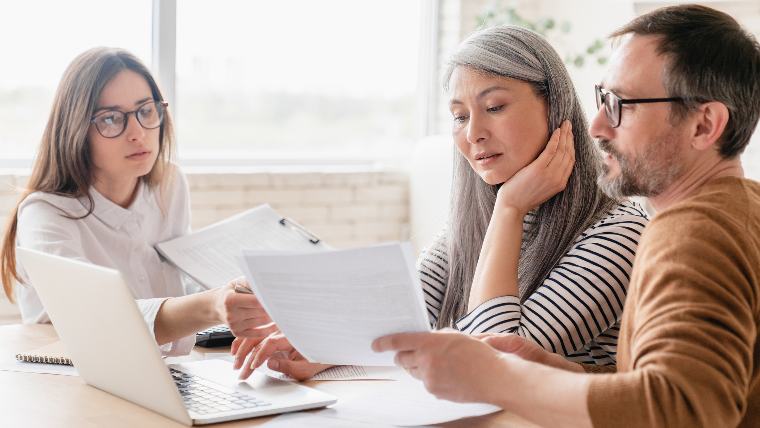 Attorney working with two clients.