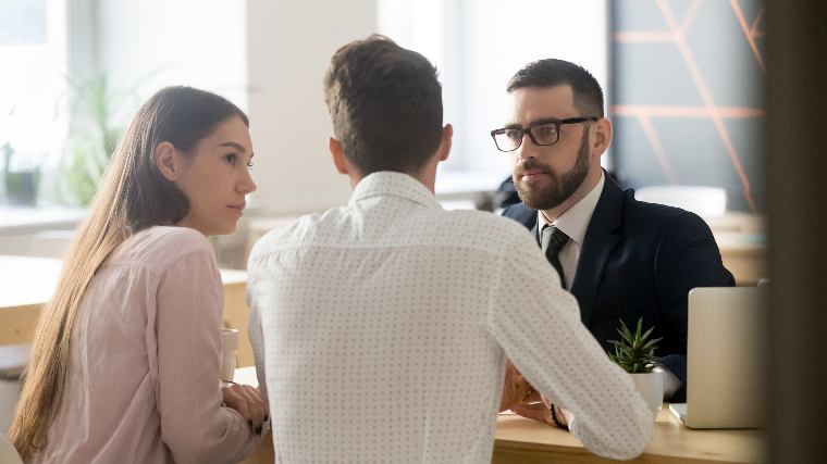 Couple consulting with a lawyer.