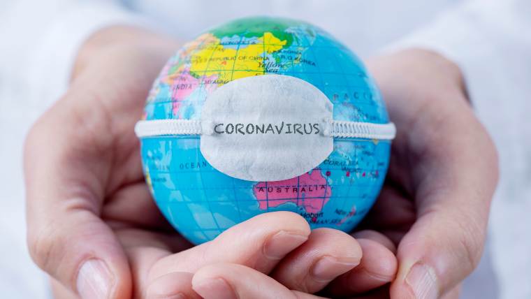 A small globe with the word coronavirus written on it
