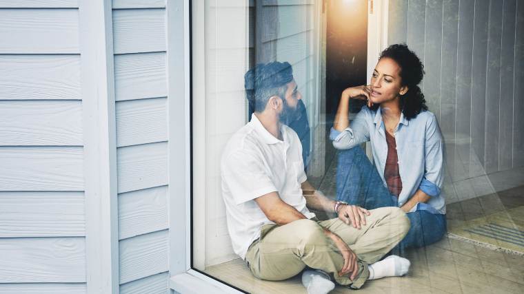 couple having a conversation in their house