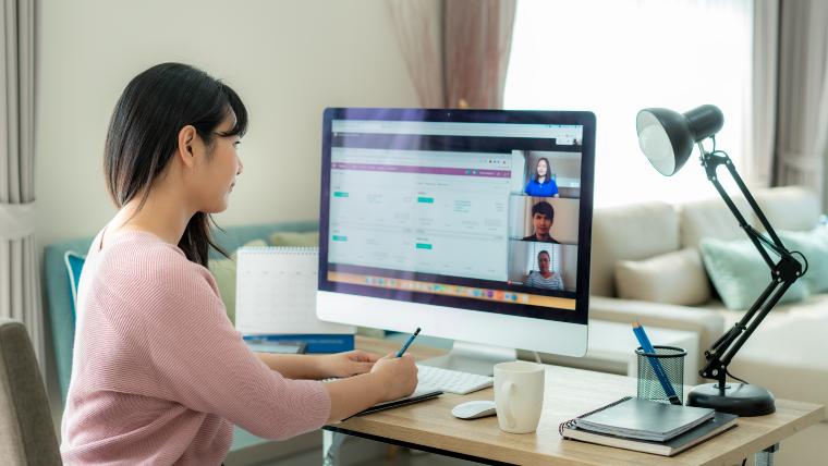 women working from home and participating in a virtual meeting