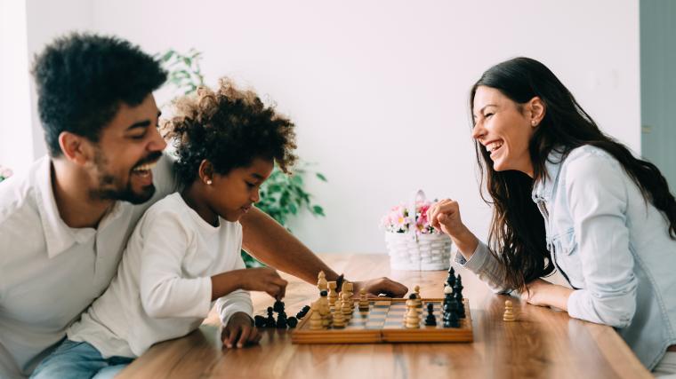 family playing chess together