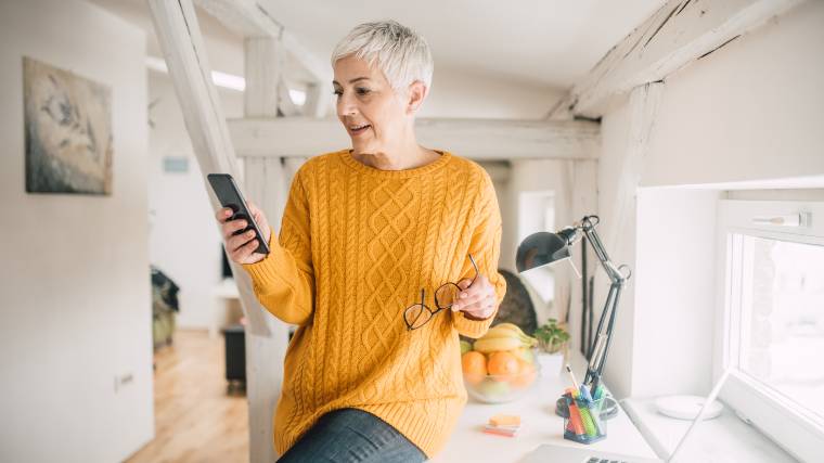 woman reviewing information on her cellphone