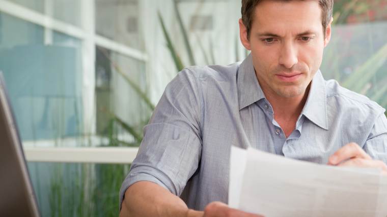 man reviewing legal documents