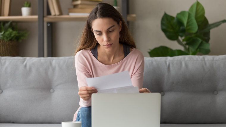 Woman reading a rejection letter.