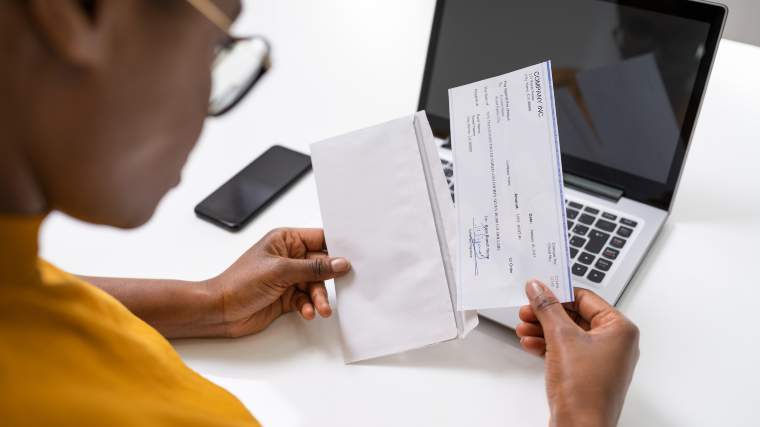 Woman reviewing her paycheck.