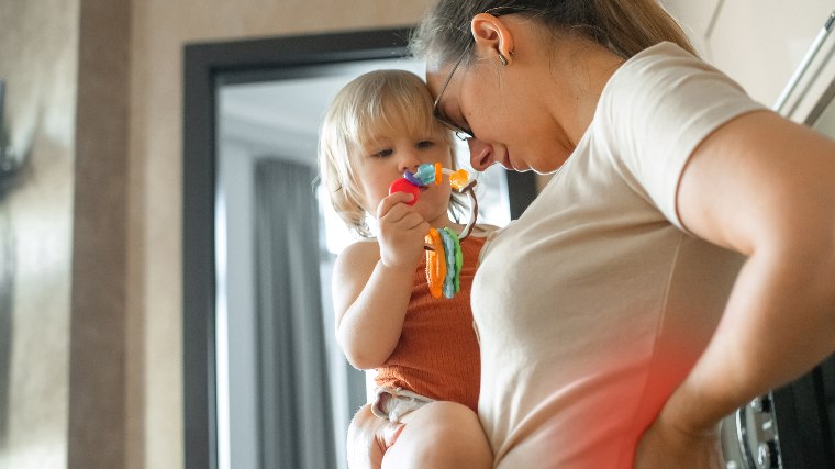 Woman holding small child.