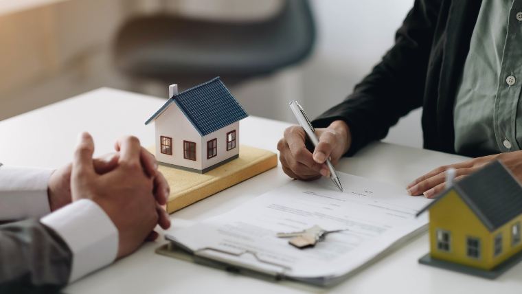 Signing mortgage documents.