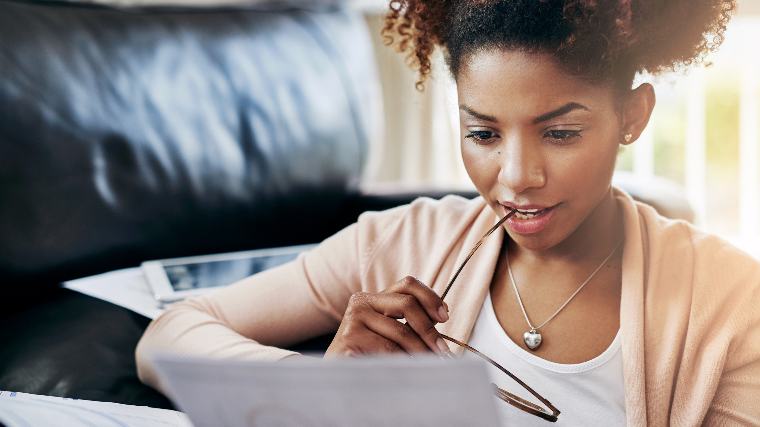 Woman reading a credit card agreement.