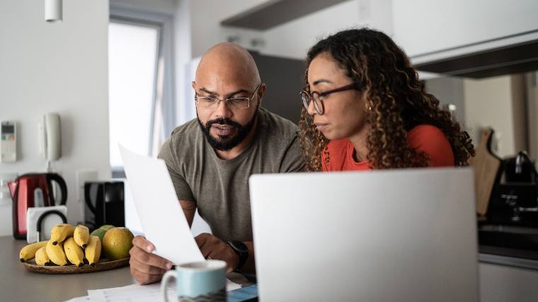 Couple reviewing their finances together.