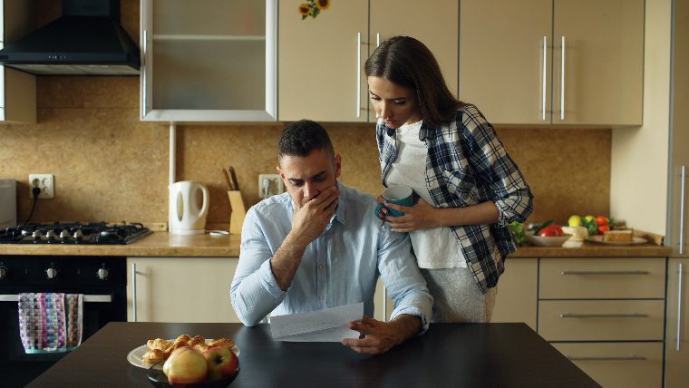 Couple looking at bills.