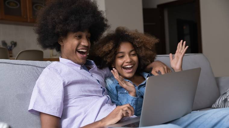 Young couple with laptop.