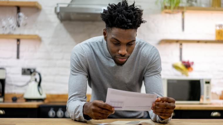 Man reading letter.