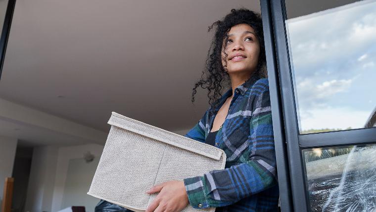 Young woman moving out of an apartment.