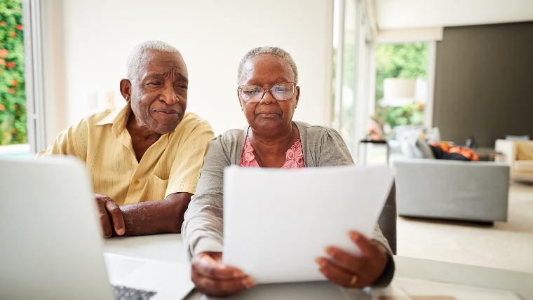 Senior couple reviewing documents.