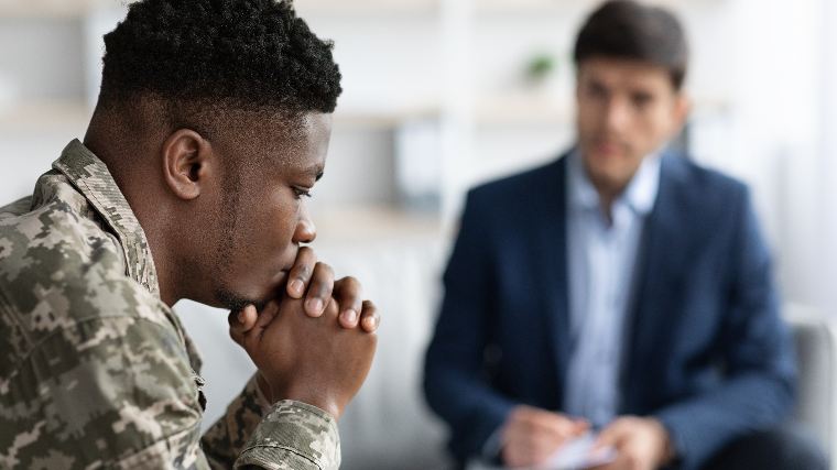 Young military recruit meets with counselor.