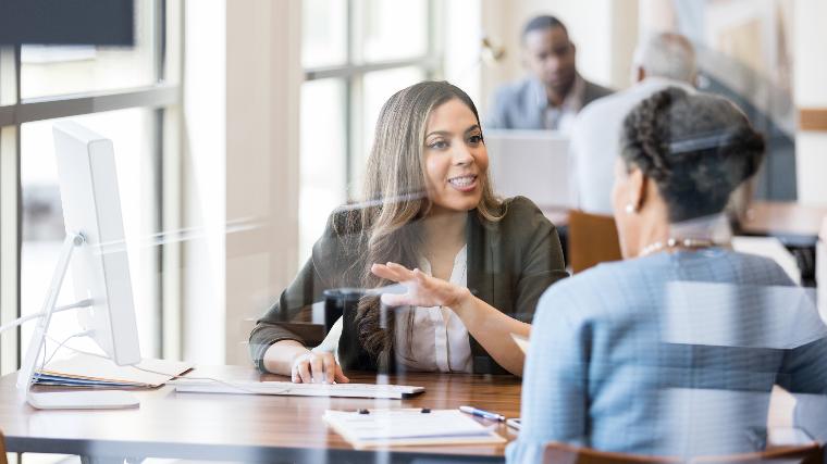 Loan officer speaking with client.