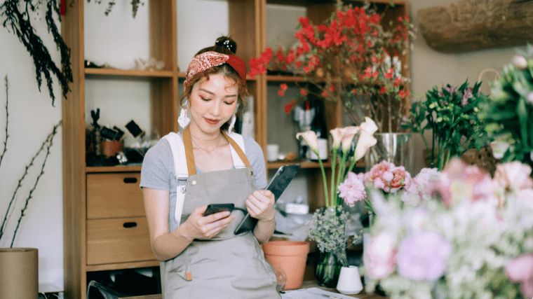 Young woman working in flower shop.