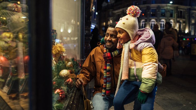 Father and daughter Christmas shopping.