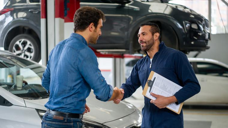 Mechanic meeting with car owner.