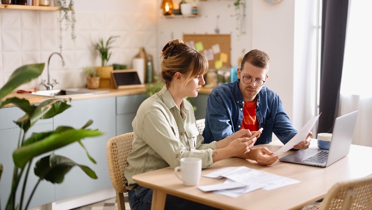 Young couple working on their finances together.